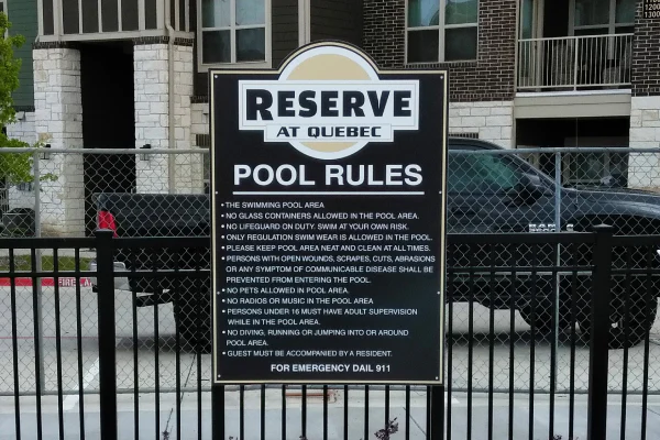 an apartment complex with an apartment sign in front of it dallas tx