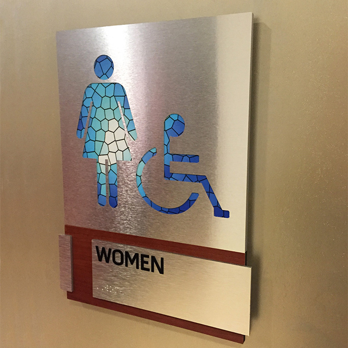 women bathroom ada sign installed at wall dallas tx